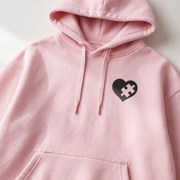 Sweat à capuche rose avec cœur puzzle noir sur la poitrine | market_france