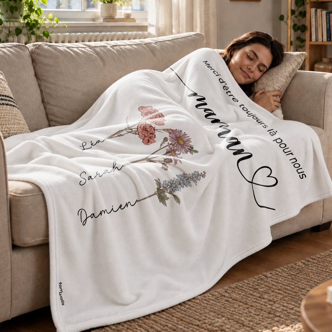 Femme endormie sur un canapé sous le plaid blanc Des fleurs pour maman market_france
